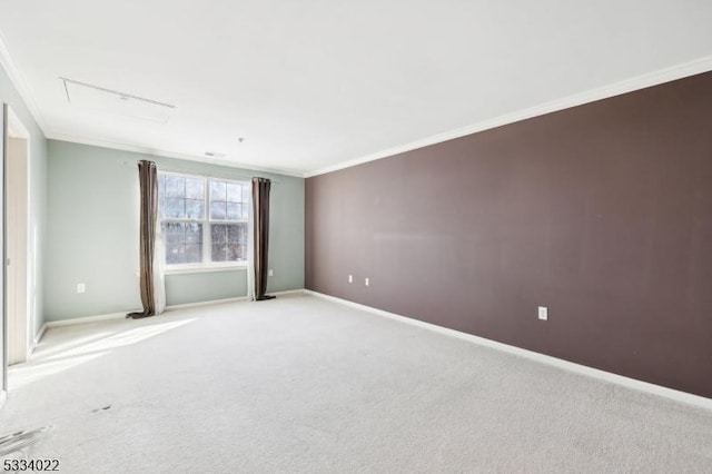 carpeted spare room with crown molding