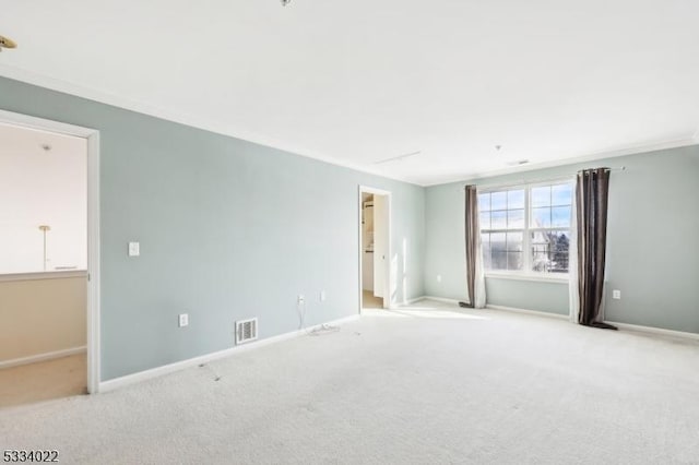 unfurnished room featuring light colored carpet