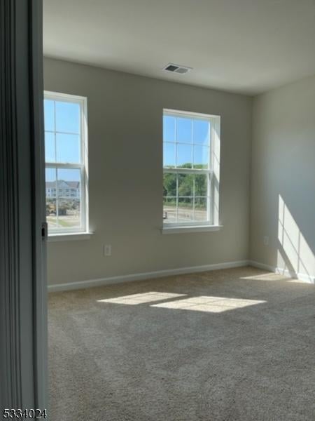 spare room with carpet flooring