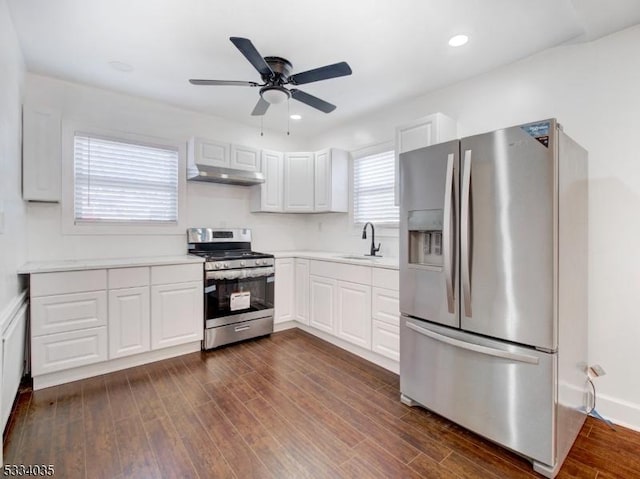 kitchen with sink, white cabinetry, dark hardwood / wood-style floors, and appliances with stainless steel finishes