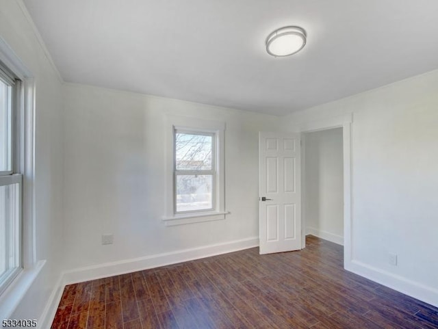 empty room featuring dark hardwood / wood-style flooring