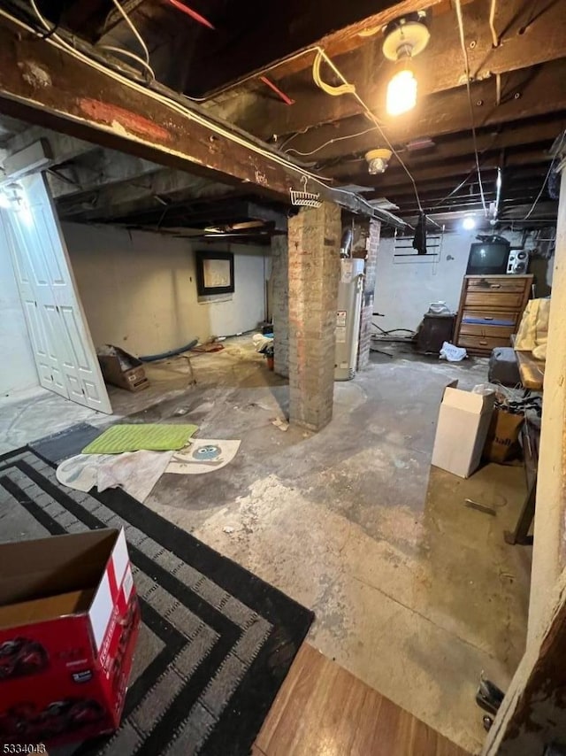 basement featuring gas water heater