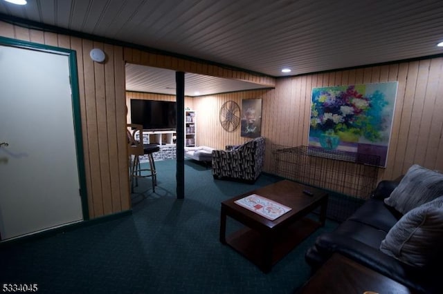 living room featuring wooden walls and carpet flooring