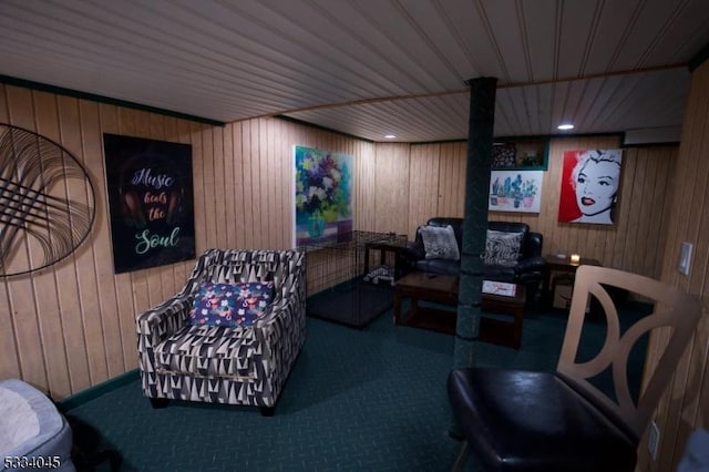 interior space with carpet flooring, wooden ceiling, and wood walls