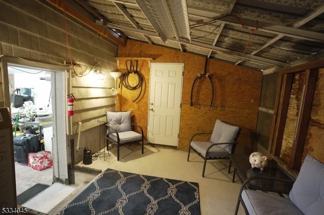 sitting room featuring concrete floors