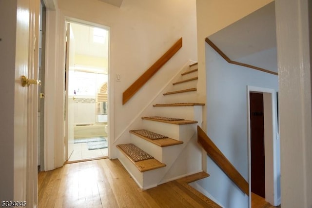 staircase featuring hardwood / wood-style flooring