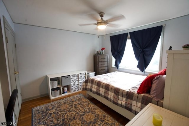 bedroom with hardwood / wood-style flooring and ceiling fan