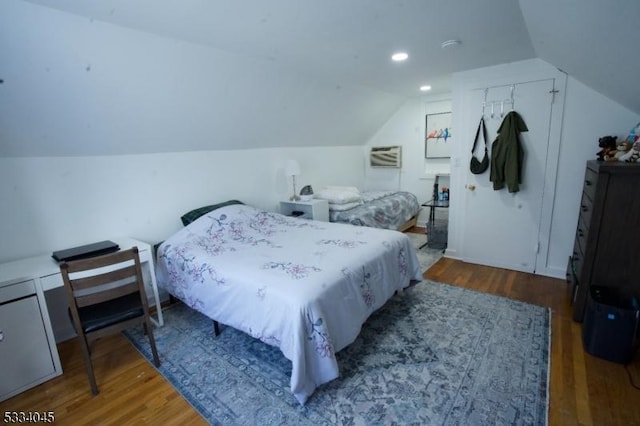 bedroom featuring dark hardwood / wood-style flooring