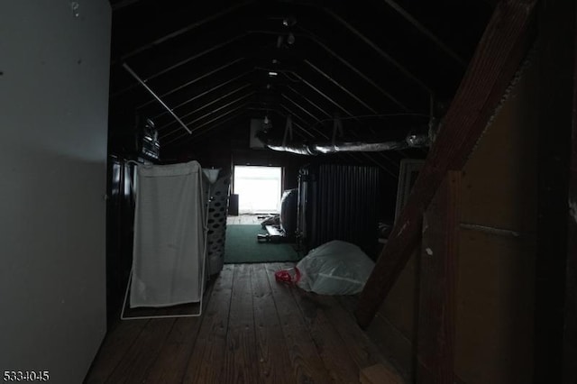 interior space featuring lofted ceiling and hardwood / wood-style floors