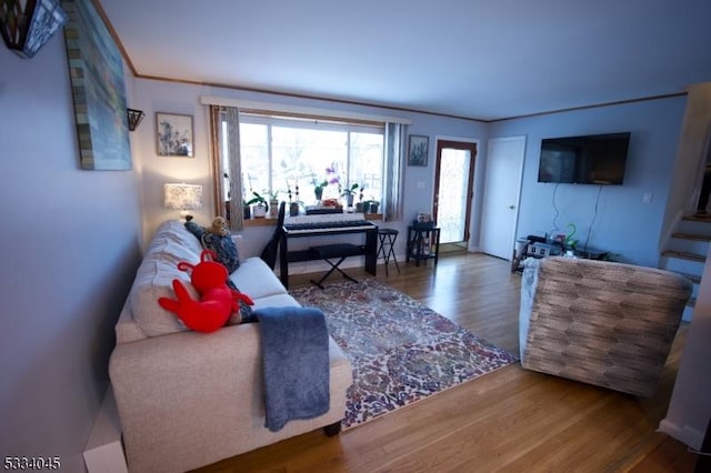 living room featuring a healthy amount of sunlight and hardwood / wood-style floors