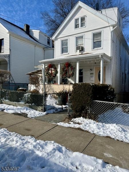 view of front property featuring covered porch