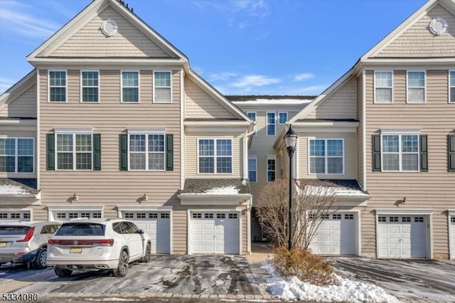 multi unit property featuring a garage