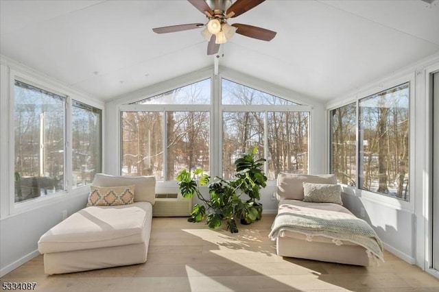 sunroom featuring lofted ceiling, plenty of natural light, and ceiling fan