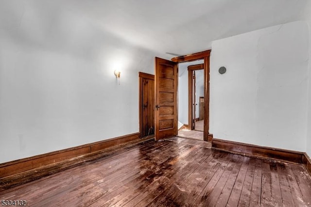 empty room featuring wood-type flooring