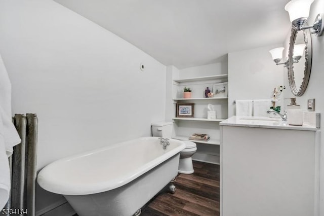 bathroom featuring vanity, toilet, a bathing tub, and hardwood / wood-style floors