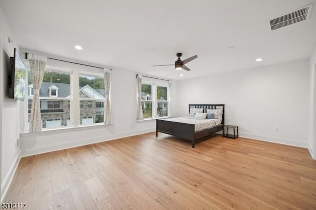 unfurnished bedroom featuring ceiling fan and light wood-type flooring