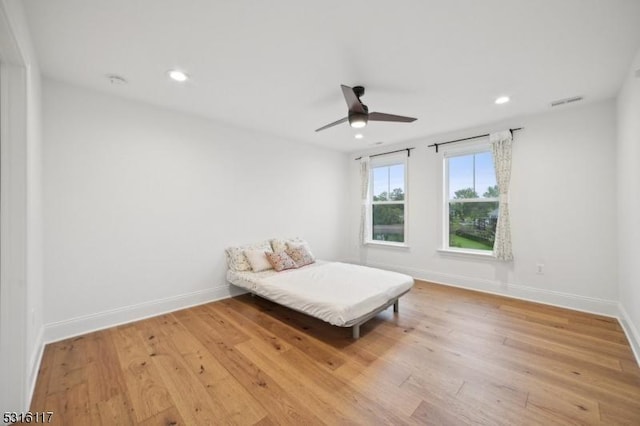 unfurnished bedroom with light hardwood / wood-style flooring and ceiling fan