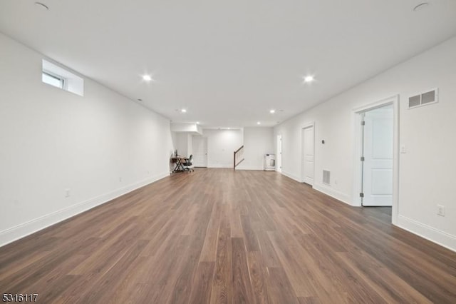 basement featuring dark hardwood / wood-style flooring