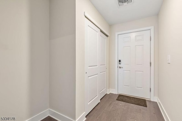 doorway to outside with hardwood / wood-style floors