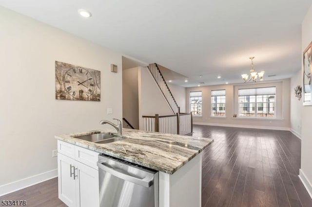 kitchen with sink, dishwasher, an inviting chandelier, light stone counters, and white cabinets