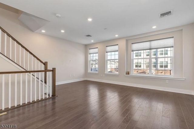 unfurnished room featuring dark wood-type flooring