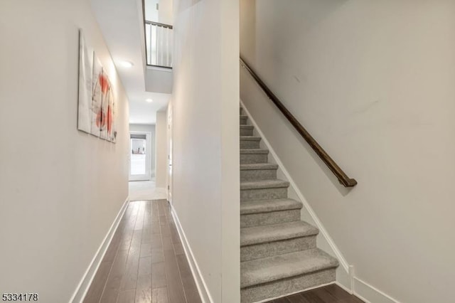 stairway featuring hardwood / wood-style floors