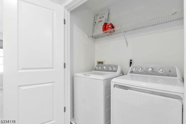 washroom featuring washer and dryer