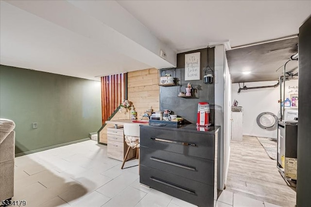 kitchen featuring wood walls