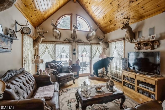 living room with wood-type flooring, beam ceiling, high vaulted ceiling, and wooden ceiling