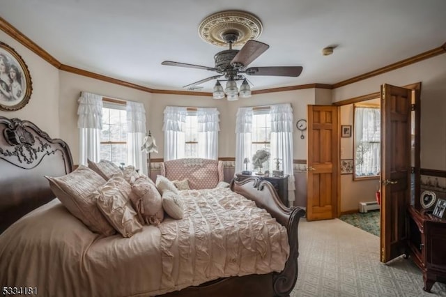 carpeted bedroom with ornamental molding, ceiling fan, and baseboard heating