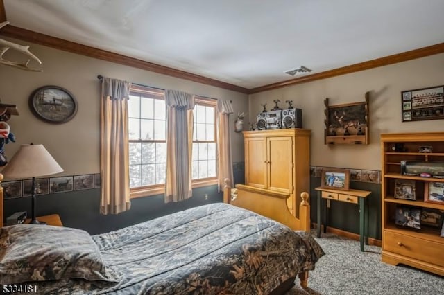 carpeted bedroom with ornamental molding