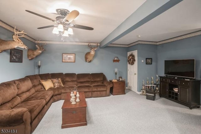 carpeted living room featuring crown molding and ceiling fan