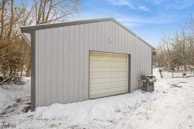 view of snow covered garage