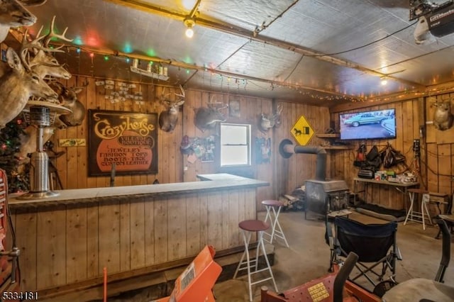 bar with concrete floors and wood walls