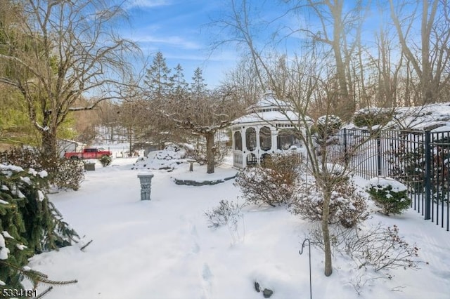 view of yard layered in snow