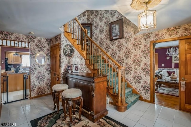 stairway featuring tile patterned flooring