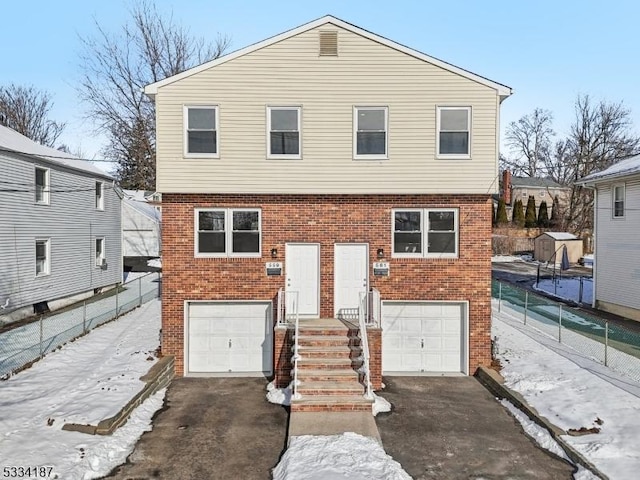 view of front of property with a garage