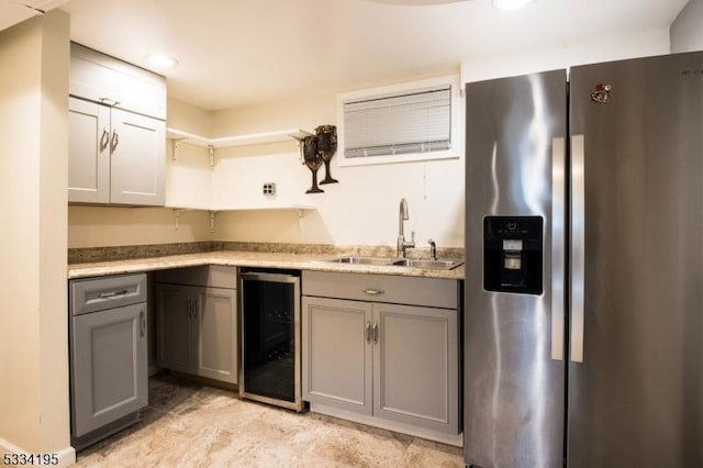 kitchen with wine cooler, sink, gray cabinets, and stainless steel refrigerator with ice dispenser