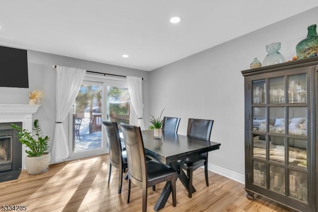 dining space featuring light wood-type flooring