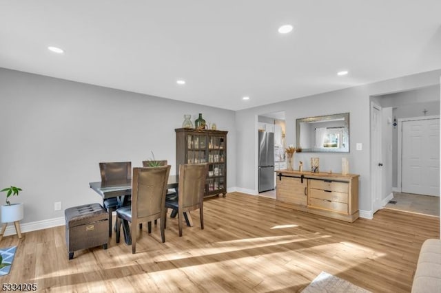 dining room with light hardwood / wood-style floors