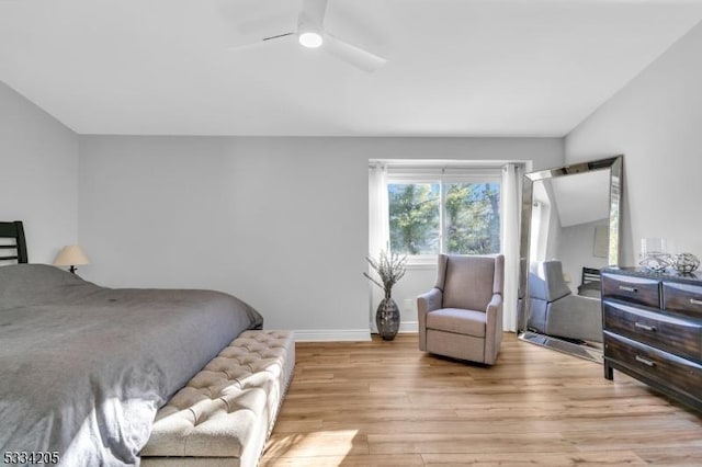 bedroom with ceiling fan and light hardwood / wood-style floors