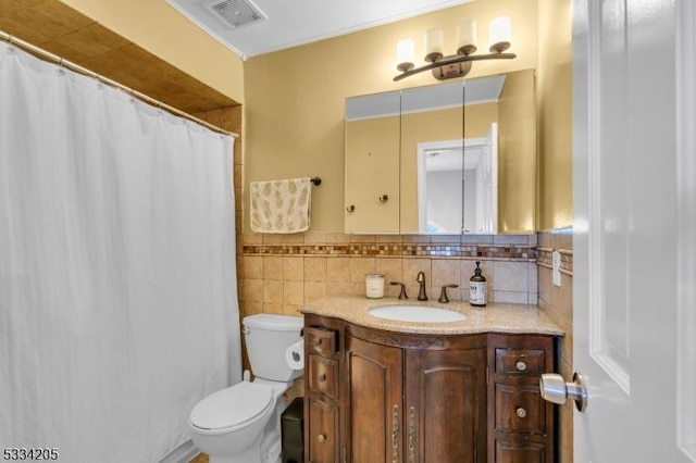 bathroom featuring vanity, a shower with shower curtain, decorative backsplash, and toilet