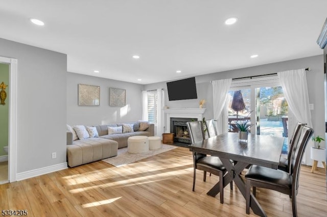 dining area with light hardwood / wood-style flooring