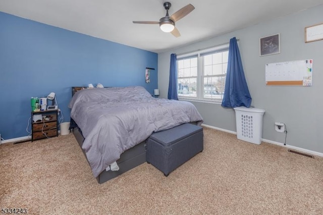 bedroom with light colored carpet and ceiling fan