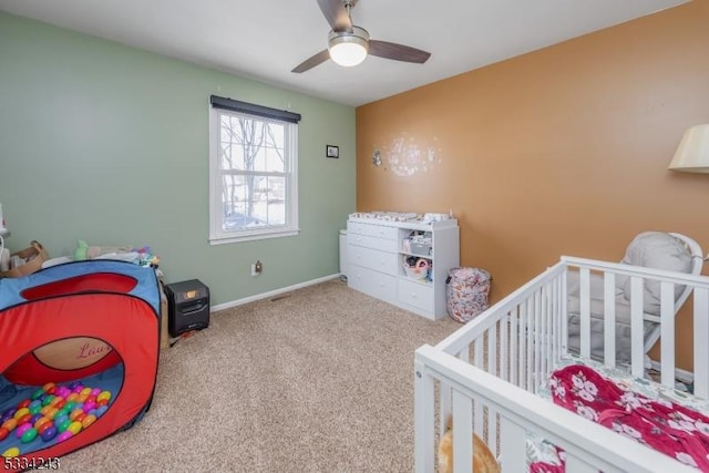 bedroom featuring ceiling fan and carpet