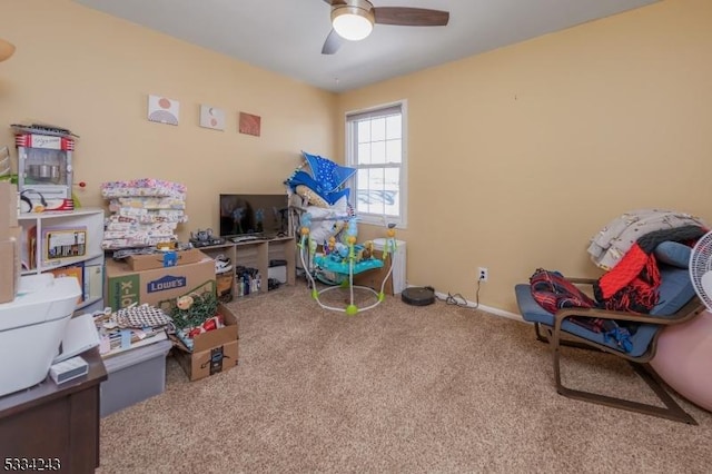 rec room with carpet floors and ceiling fan