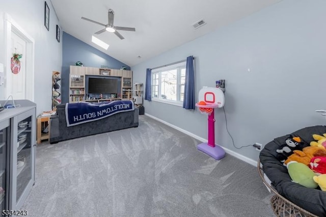 bedroom with ceiling fan, carpet flooring, and vaulted ceiling