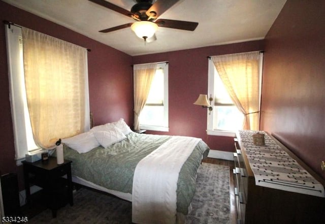 bedroom featuring hardwood / wood-style floors and ceiling fan