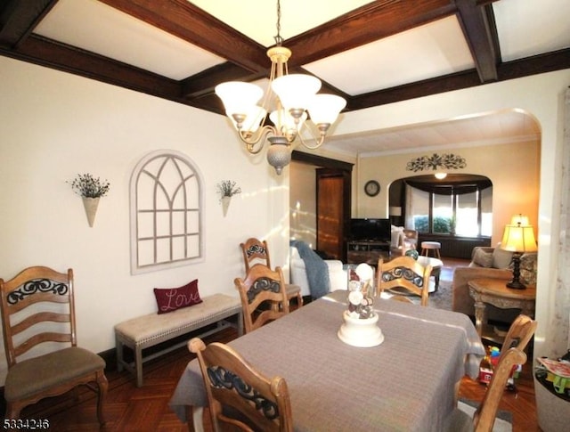 dining space featuring an inviting chandelier and parquet flooring