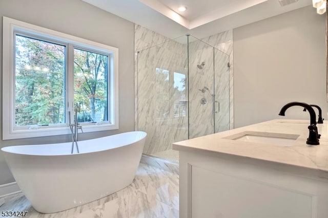 bathroom featuring independent shower and bath and vanity